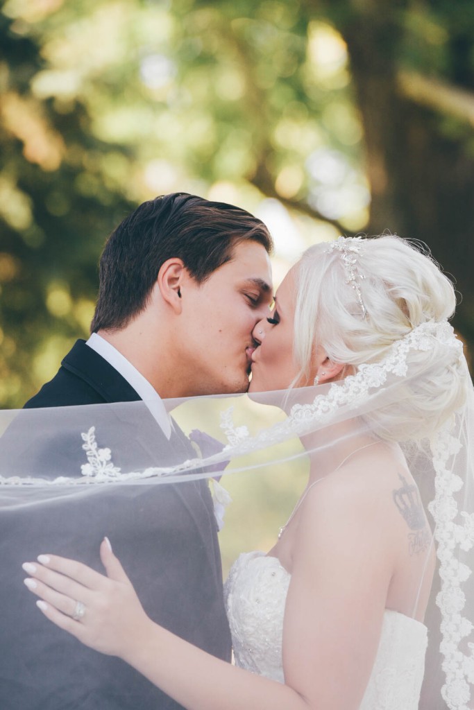 bride-and-groom-share-a-passionate-kiss-after-calgary-summer-wedding